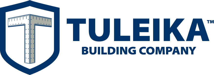 Logo of tuleika building company featuring a t-square within a shield.